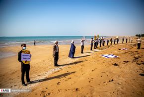 زنجیره انسانی محکومیت ترور در کنار خلیج‌فارس